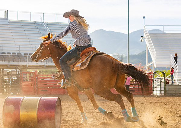 Woman riding a horse western style