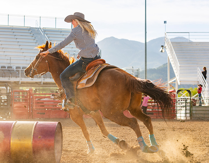 Woman riding a horse western style